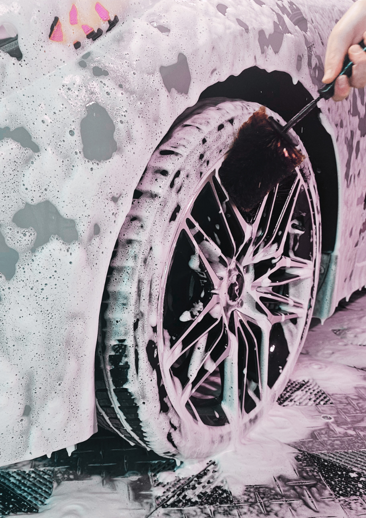 Detailer cleaning sport car rims